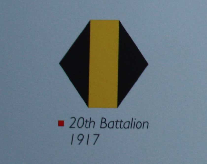 Comparable colour image of the 20th battalion Middlesex Regiment shoulder badge from 1917